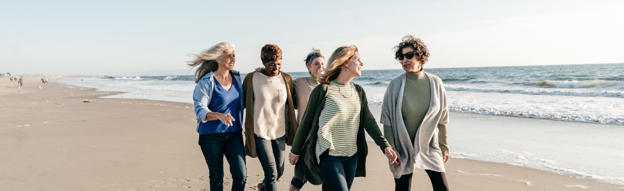 Group of women walking on a beach