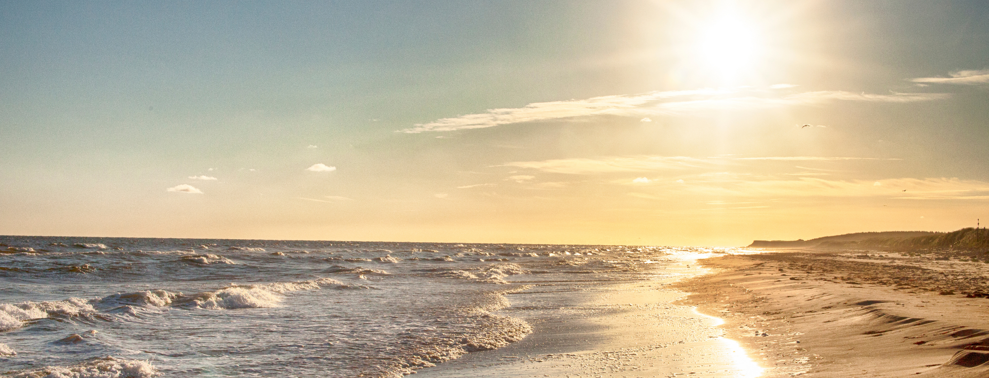 VIew of a beach and setting sun